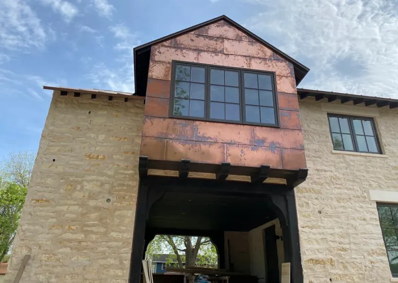 Copper metal panel facade on a stone building for Metal Roof Coating in Gainesville
